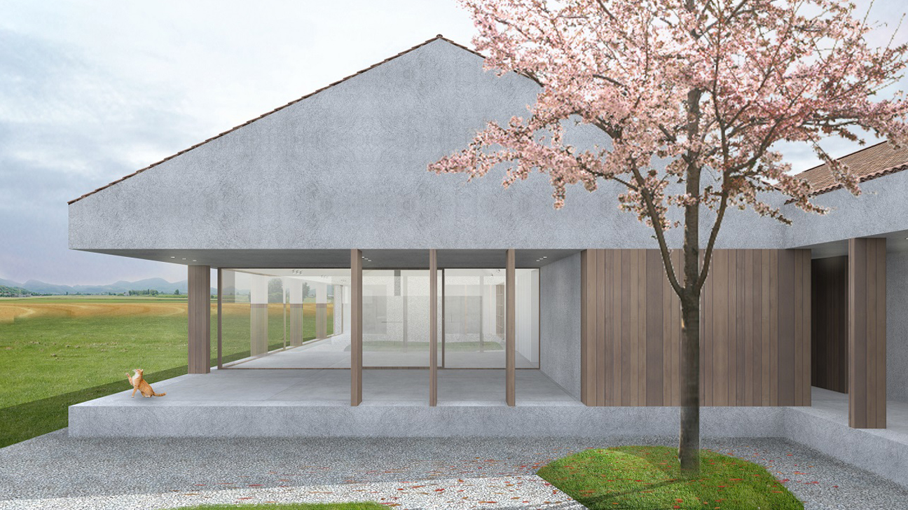 Progetto di una villa singola su un piano unico con un tetto spiovente e materiali tradizionali, grandi vetrate a tutta altezza e colonnato in legno che racchiude il portico. Un albero di ciliegio in fiore si erge in primo piano al centro del patio