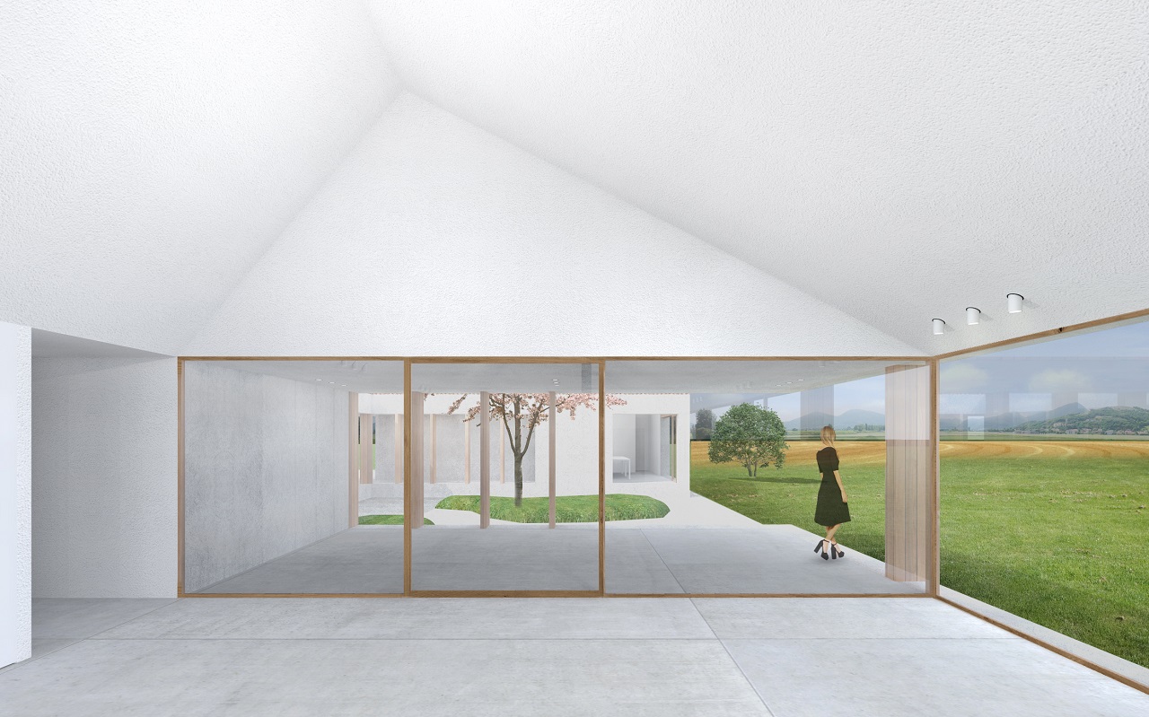  villa singola dal carattere vernacolare nella campagna padovana, sviluppata su un unico livello con tetto spiovente e materiali tradizionali. Grandi vetrate a tutta altezza e colonnato in legno racchiudono il portico che si affaccia su un meraviglioso patio 