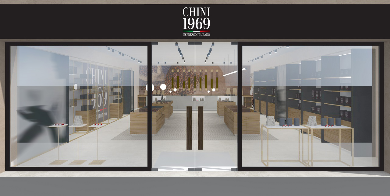 Interior design di una caffè boutique con serramento vetrato dai profili minimali e insegna con logo luminoso, che aggiunge un tocco moderno ed elegante.